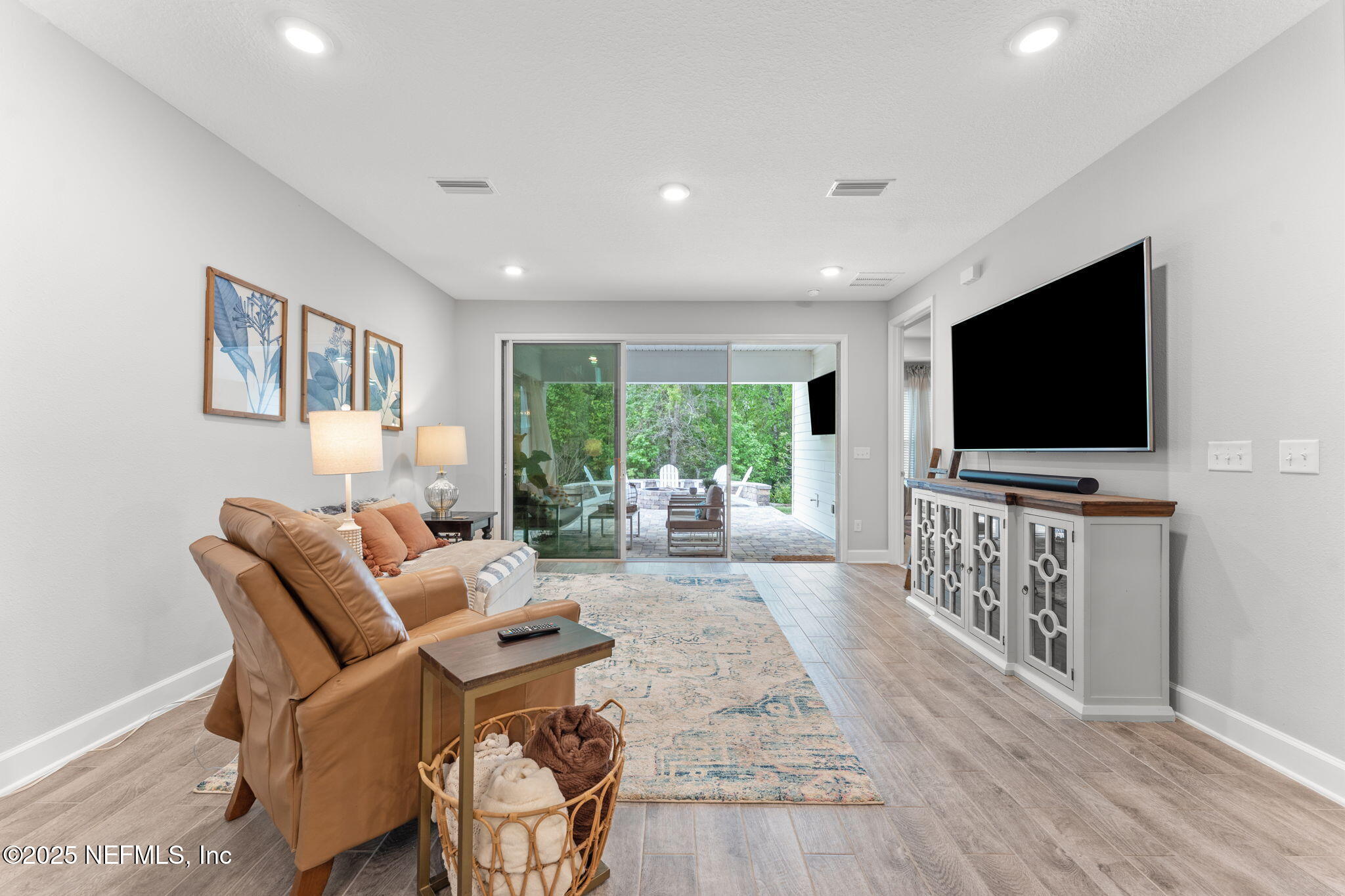 267 Windswept Way St. Augustine, FL 32092 - Photo 15 of 50 a living room with furniture and a flat screen tv