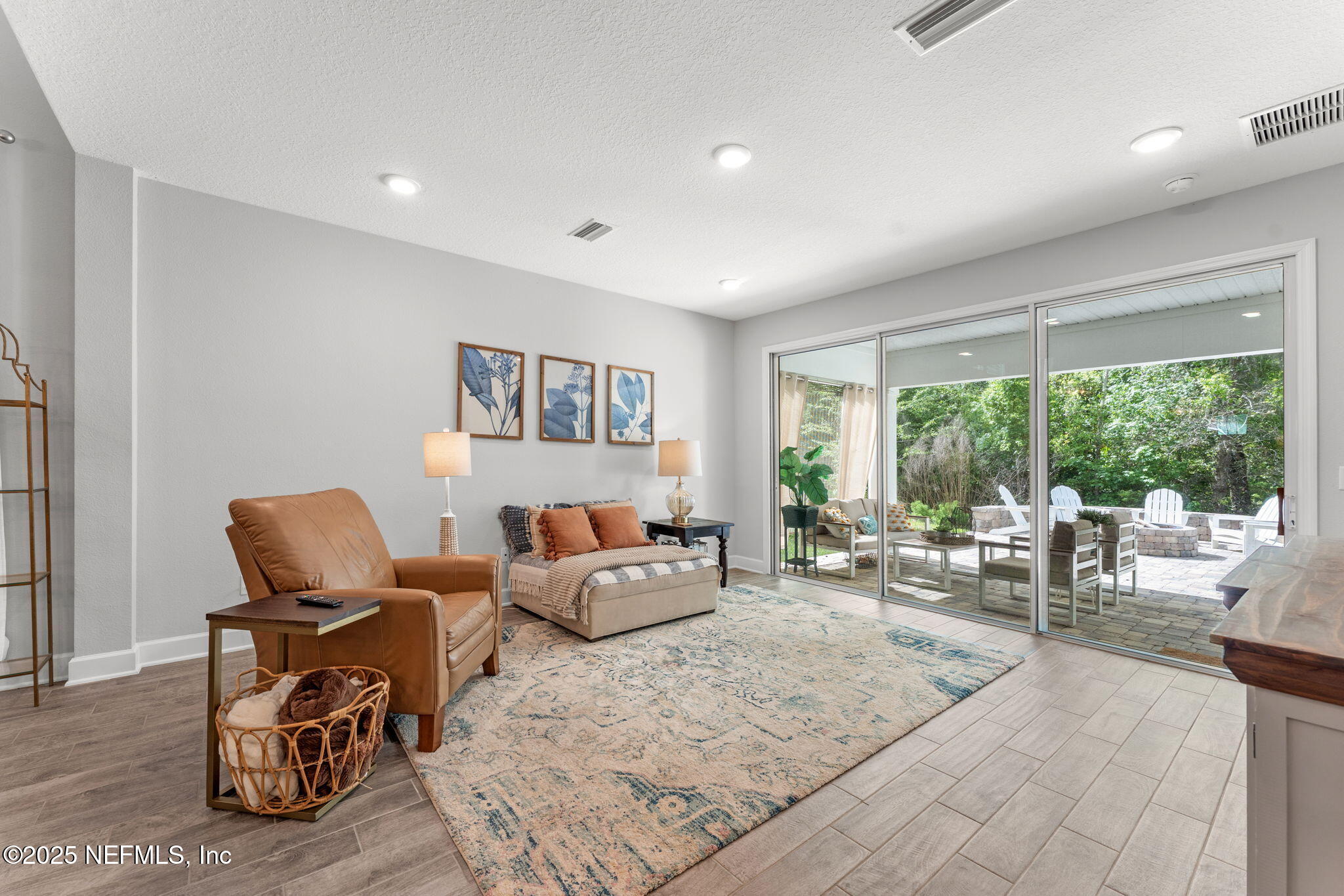 267 Windswept Way St. Augustine, FL 32092 - Photo 16 of 50 a living room with furniture and large windows
