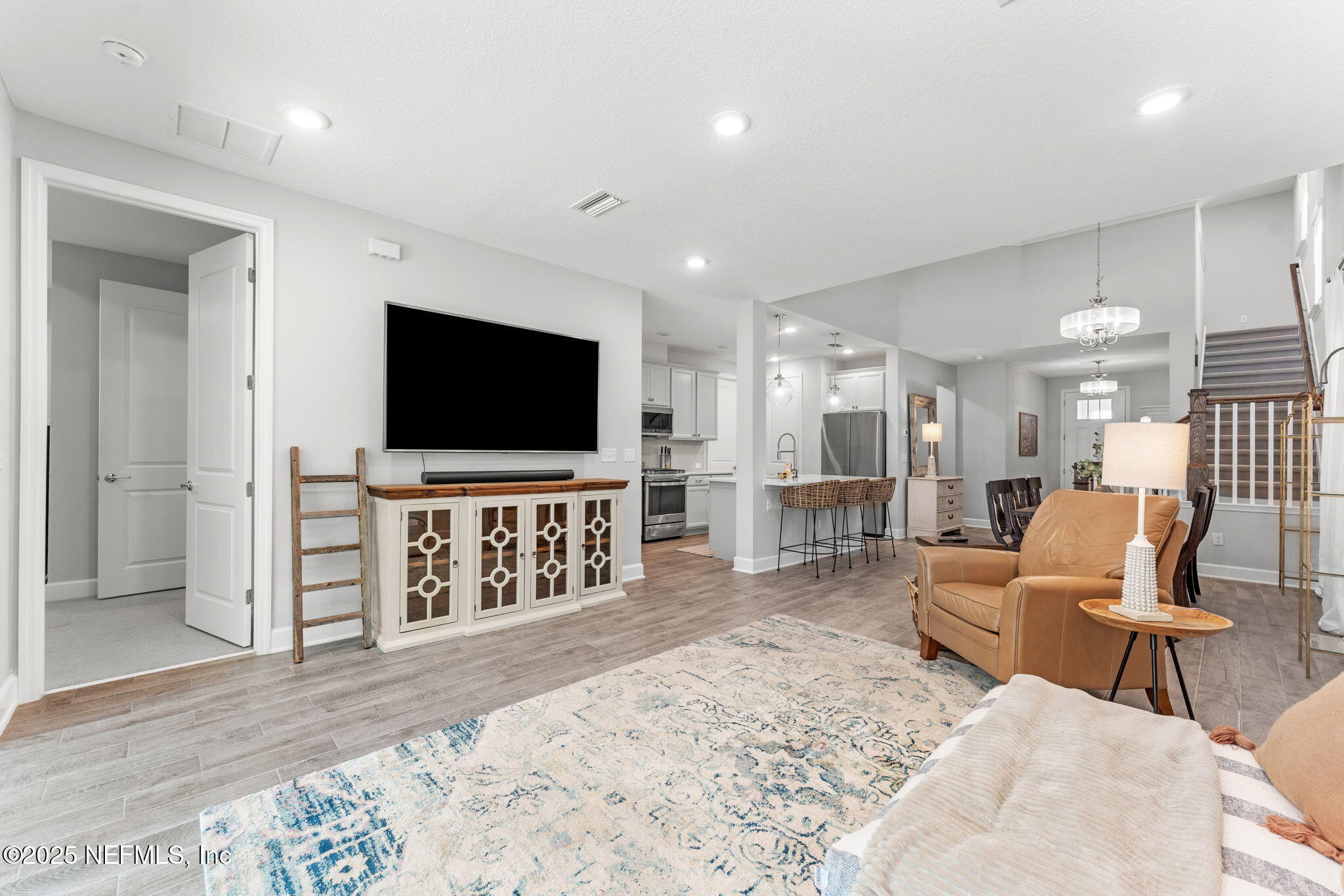 267 Windswept Way St. Augustine, FL 32092 - Photo 18 of 50 a living room with furniture and a flat screen tv