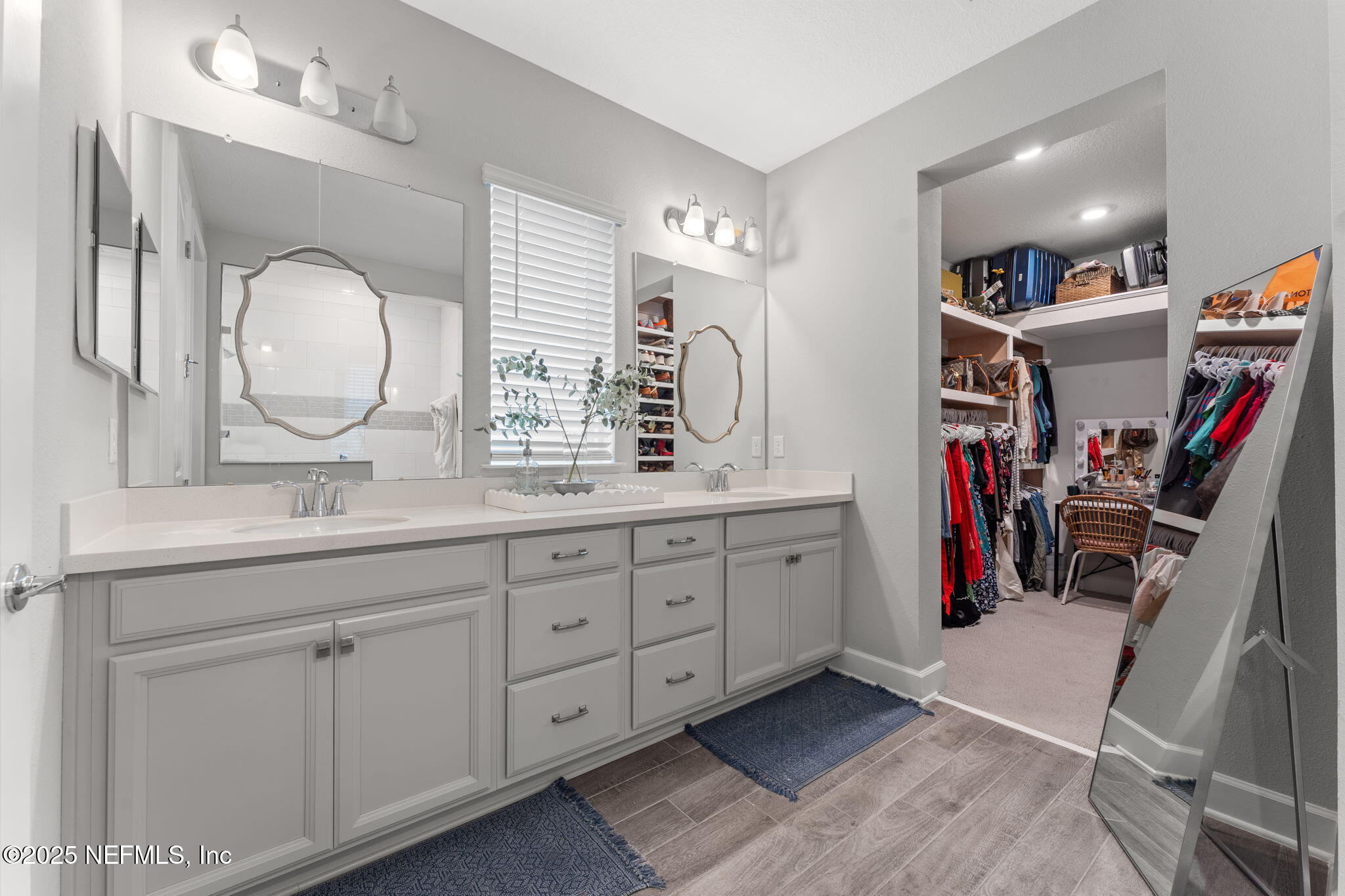 267 Windswept Way St. Augustine, FL 32092 - Photo 20 of 50 a bathroom with a double vanity sink and a mirror