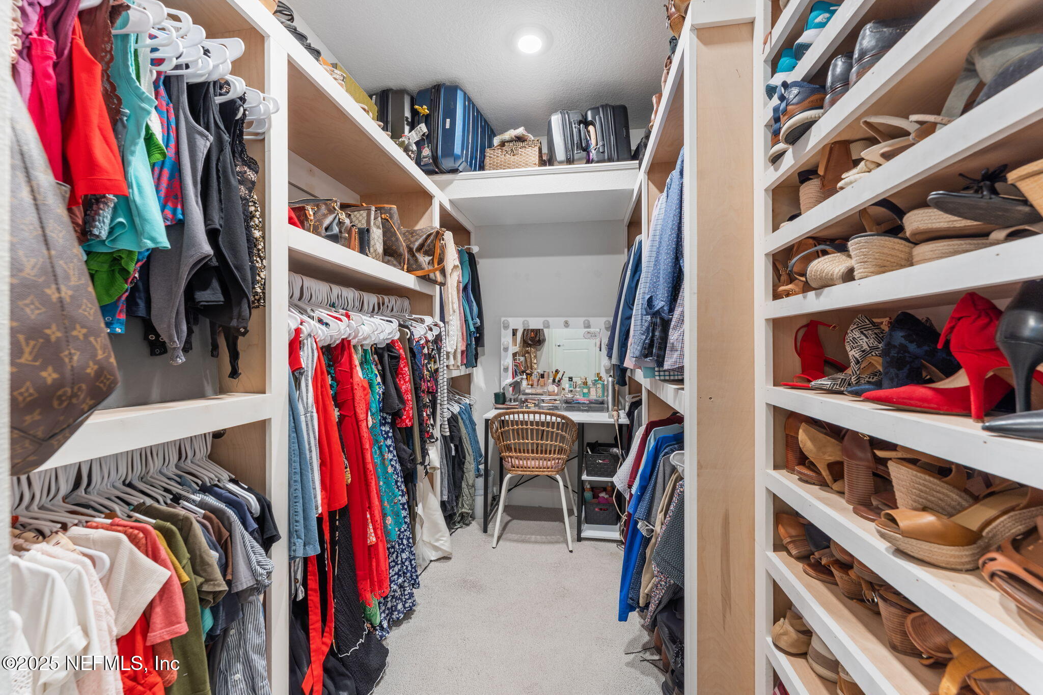 267 Windswept Way St. Augustine, FL 32092 - Photo 22 of 50 a view of walk in closet with clothes and shoes