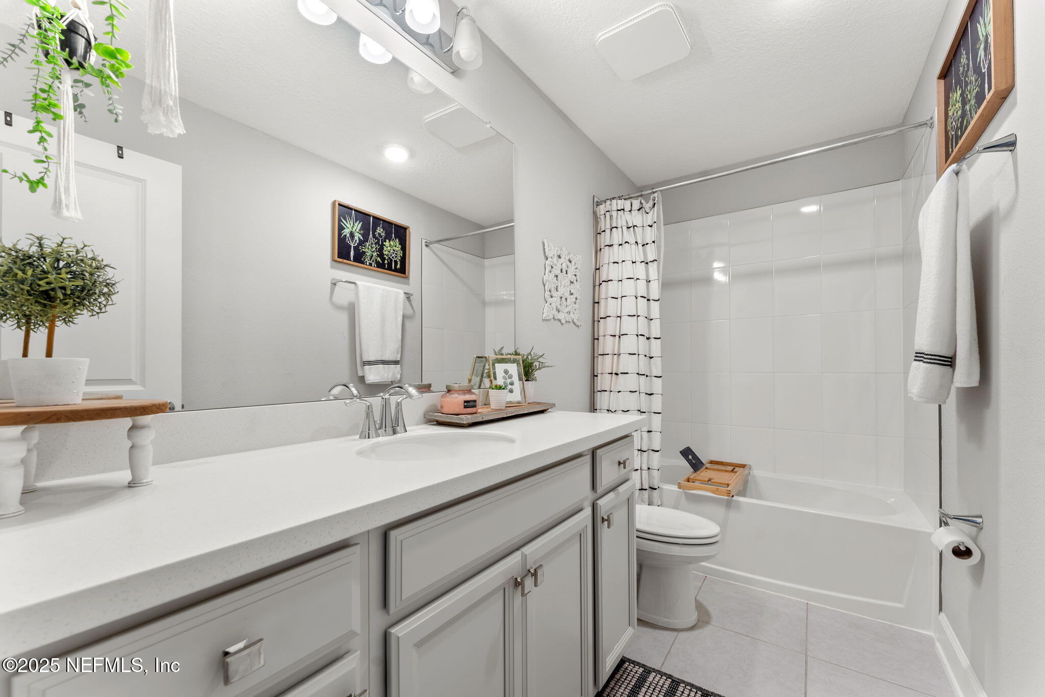 267 Windswept Way St. Augustine, FL 32092 - Photo 28 of 50 a bathroom with a sink a toilet and shower