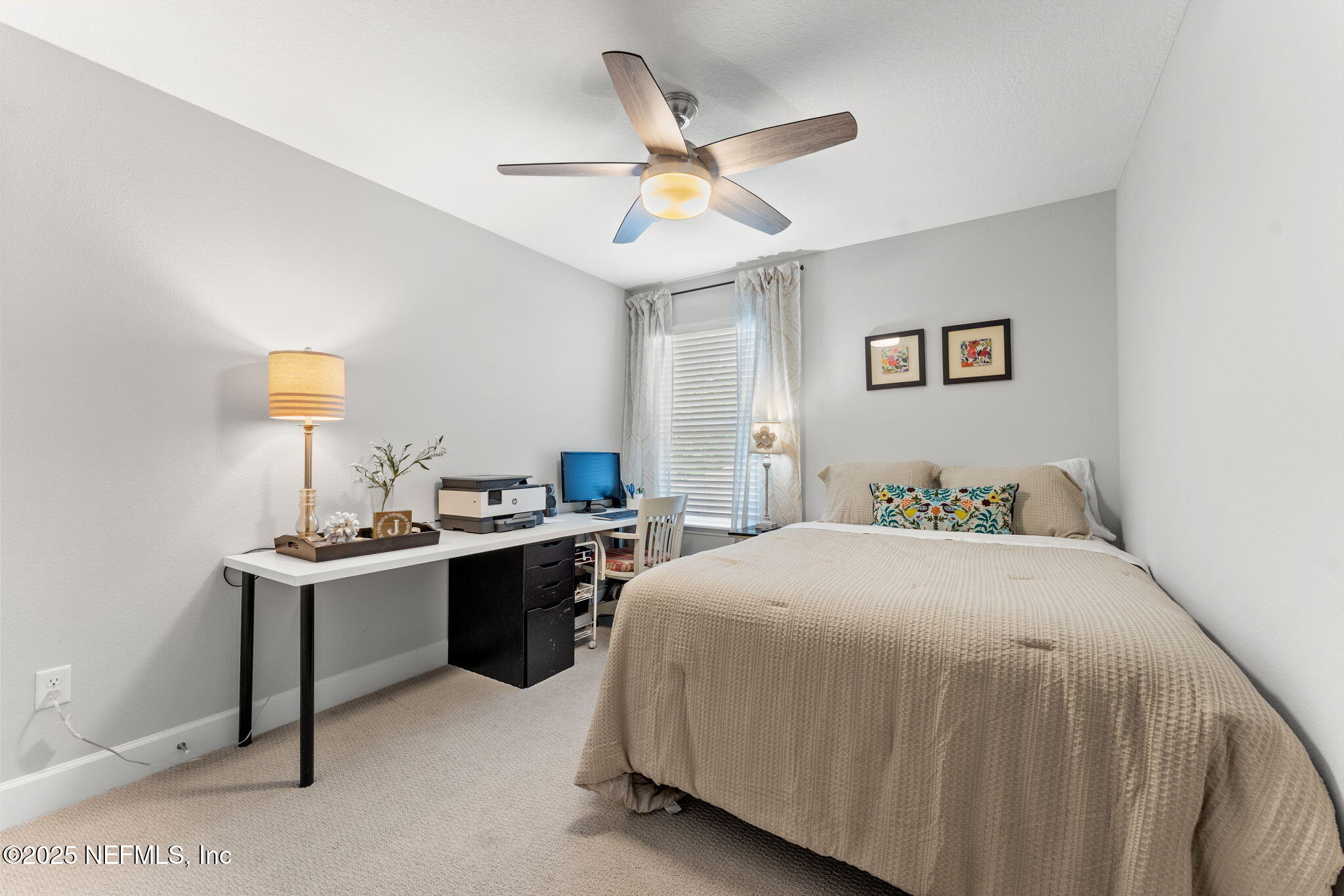 267 Windswept Way St. Augustine, FL 32092 - Photo 29 of 50 a bedroom with a bed and a desk