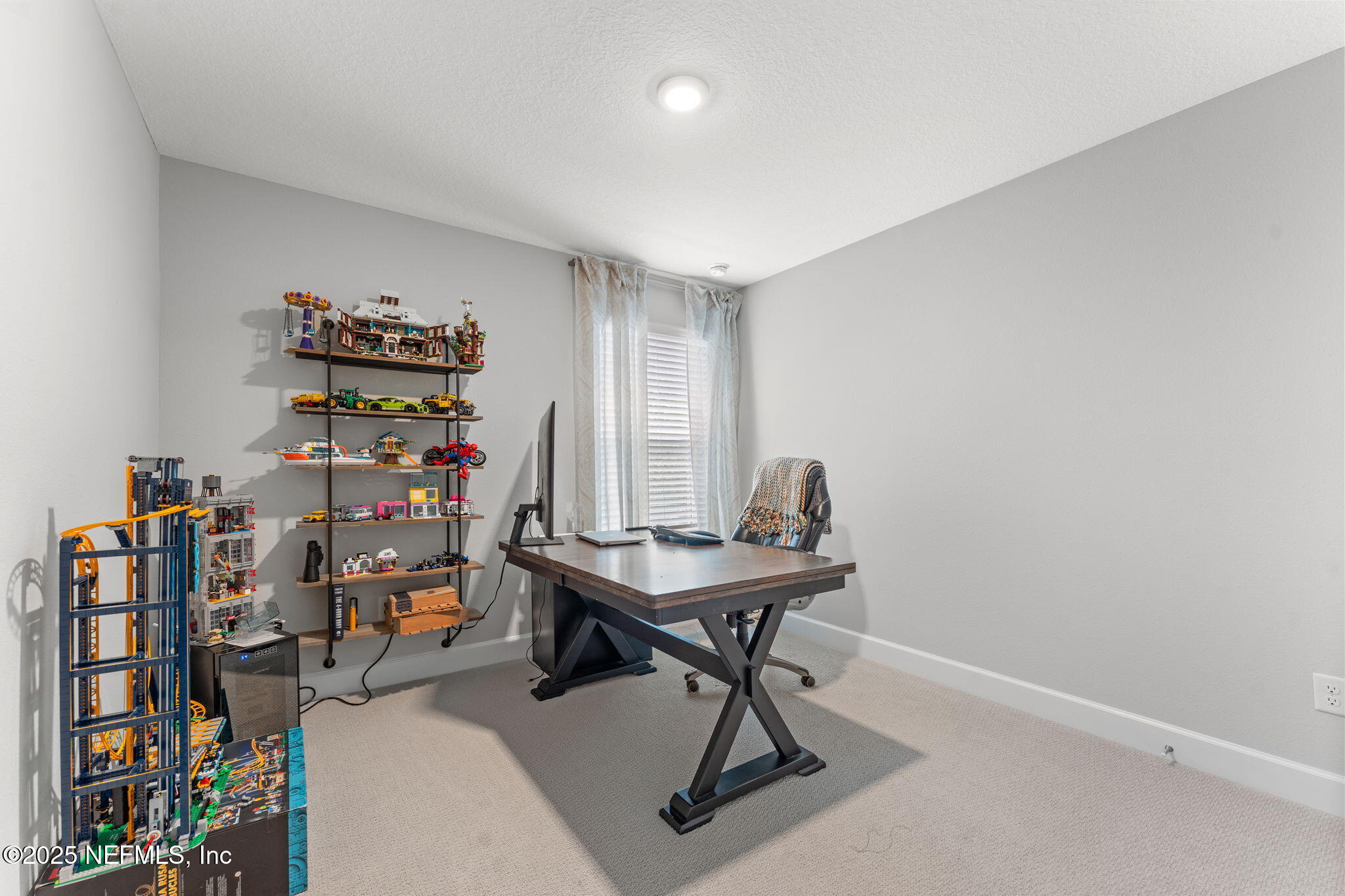 267 Windswept Way St. Augustine, FL 32092 - Photo 30 of 50 a room with furniture and book shelf