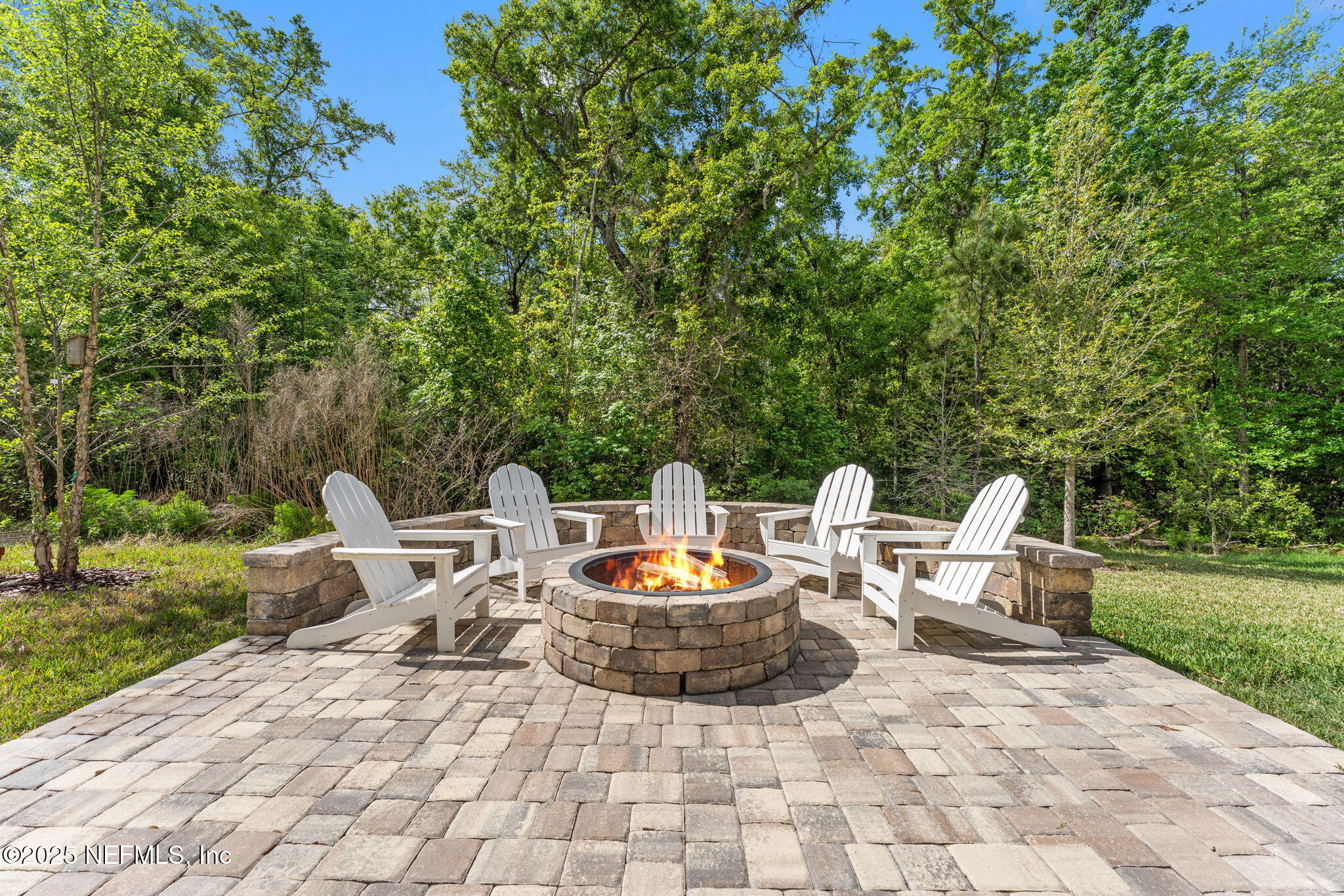 267 Windswept Way St. Augustine, FL 32092 - Photo 32 of 50 a view of a patio with a dining table and chairs