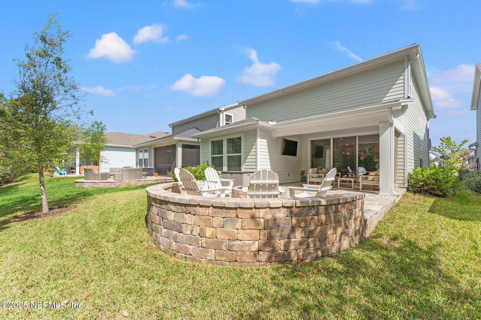 267 Windswept Way St. Augustine, FL 32092 - Photo 34 of 50 a view of a house with backyard porch and outdoor kitchen