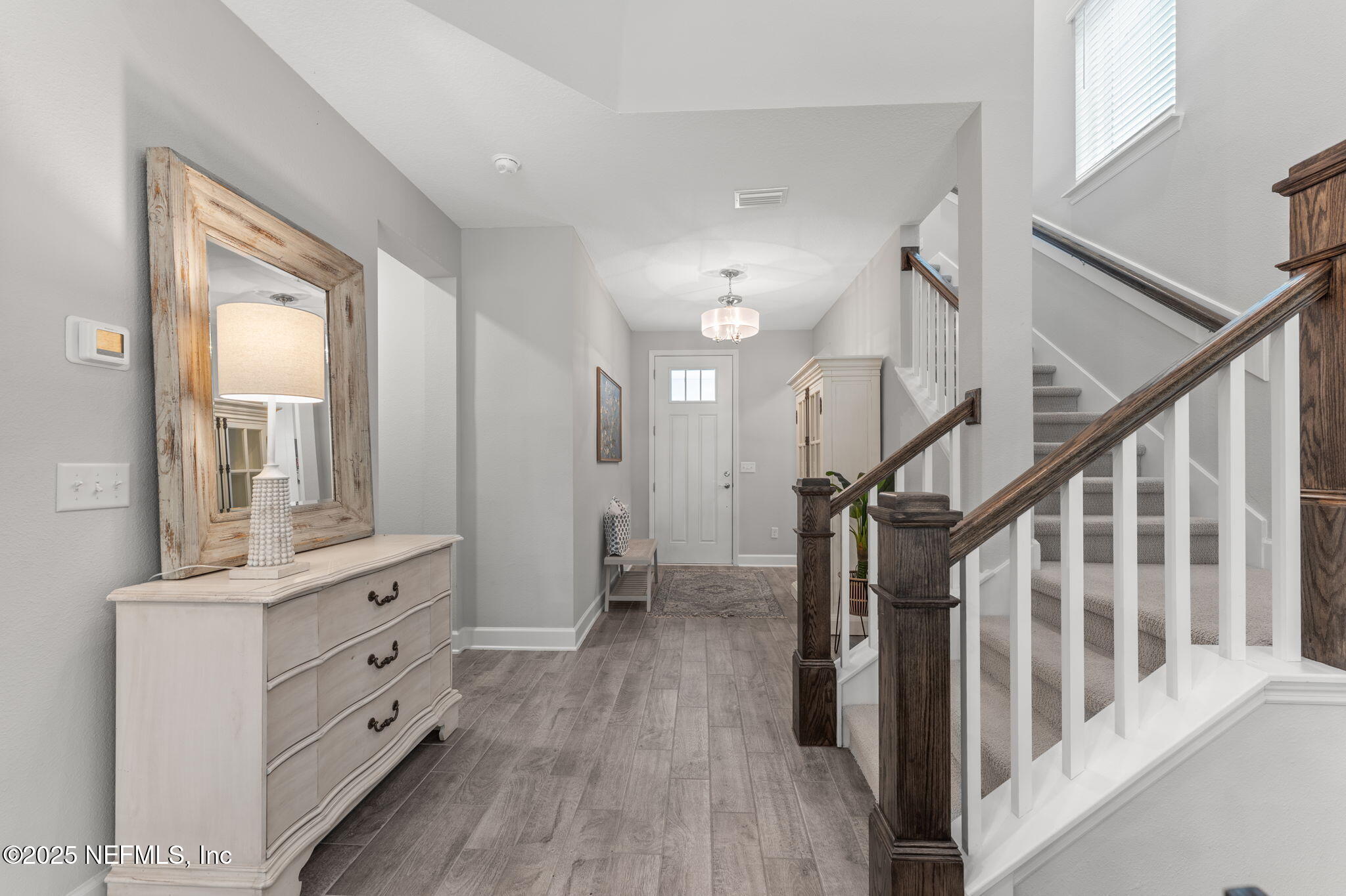267 Windswept Way St. Augustine, FL 32092 - Photo 4 of 50 a view of hallway with stairs and wooden floor