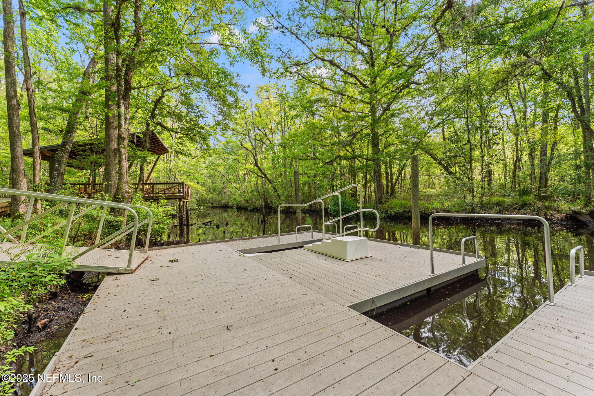 267 Windswept Way St. Augustine, FL 32092 - Photo 44 of 50 a wooden bench sitting on top of a wooden floor
