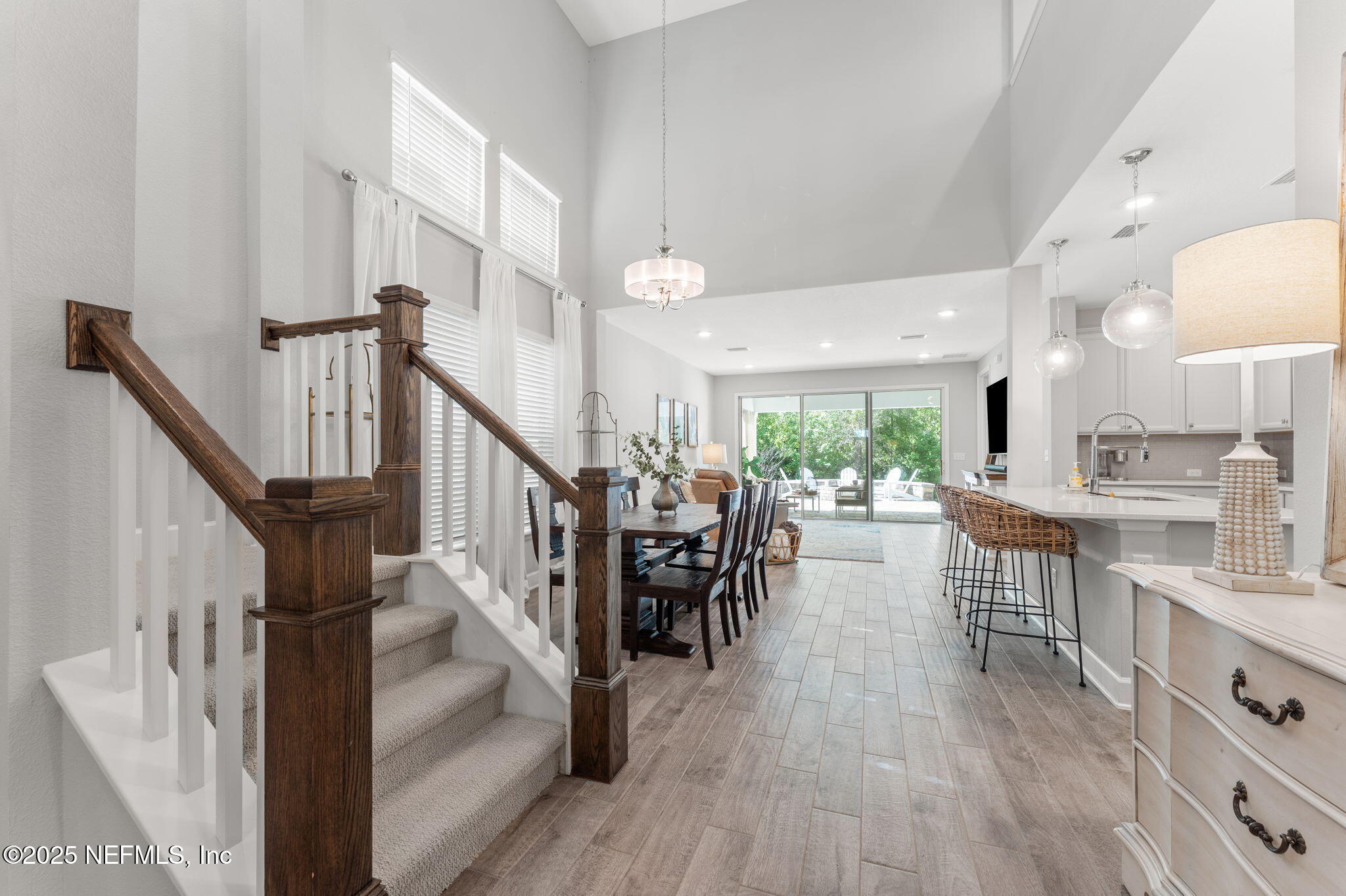 267 Windswept Way St. Augustine, FL 32092 - Photo 5 of 50 a view of dining room kitchen with furniture and wooden floor