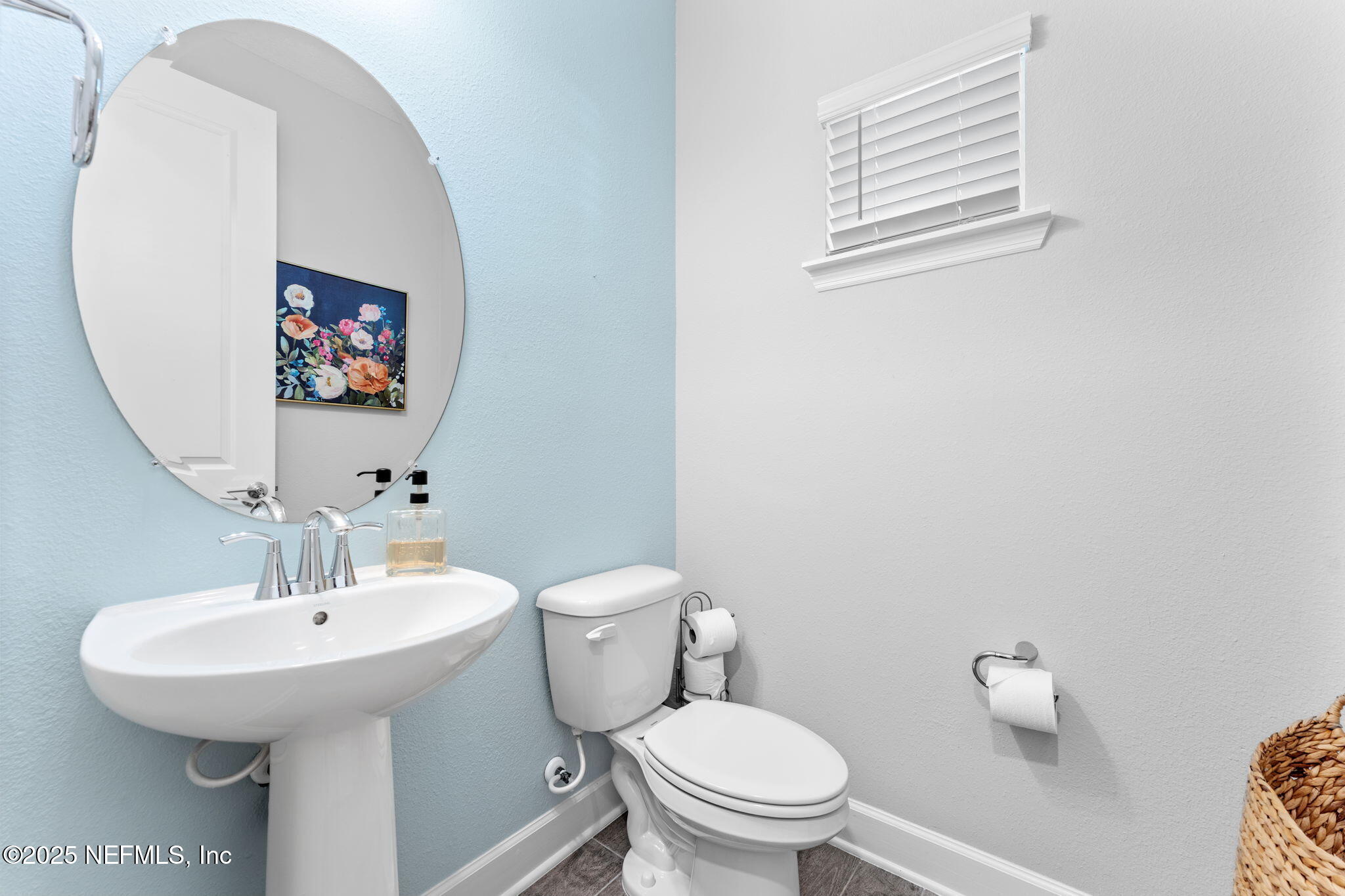 267 Windswept Way St. Augustine, FL 32092 - Photo 9 of 50 a bathroom with a toilet a sink and mirror