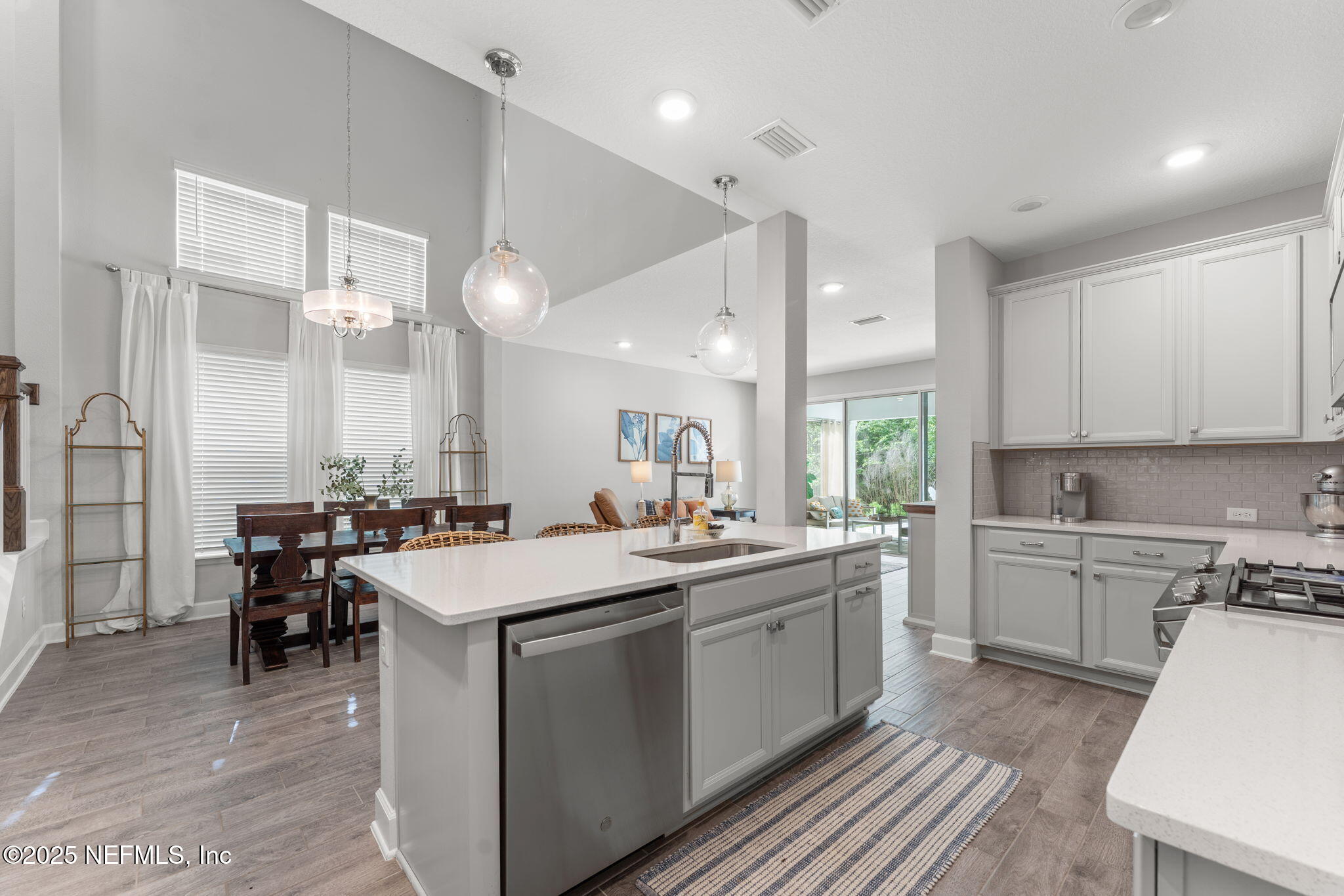 267 Windswept Way St. Augustine, FL 32092 - Photo 10 of 50 a kitchen with a sink stove and cabinets