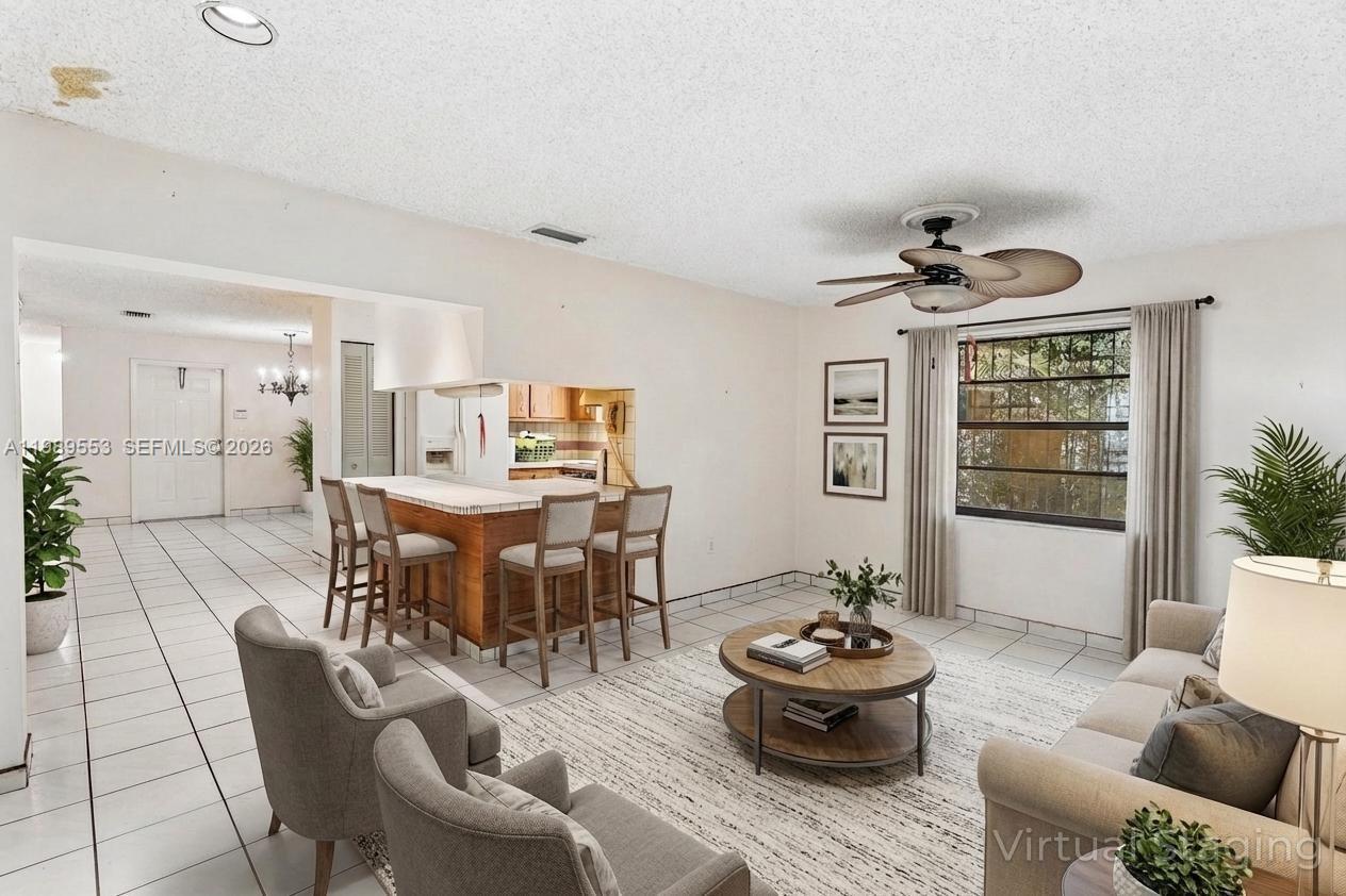 4210 Southwest 134th Avenue Miami, FL 33175 - Photo 12 of 32 a living room with furniture and wooden floor
