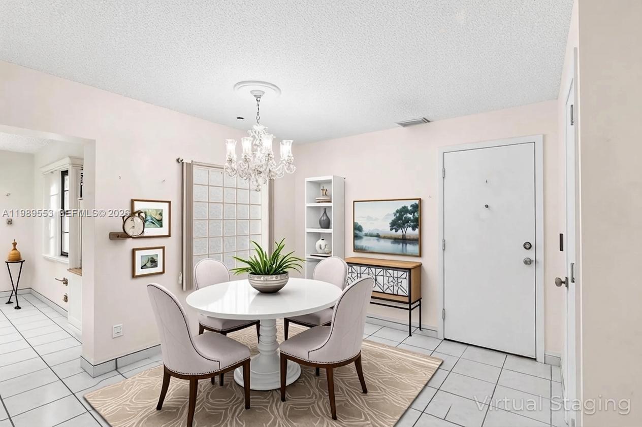 4210 Southwest 134th Avenue Miami, FL 33175 - Photo 15 of 32 a dining room with furniture and window