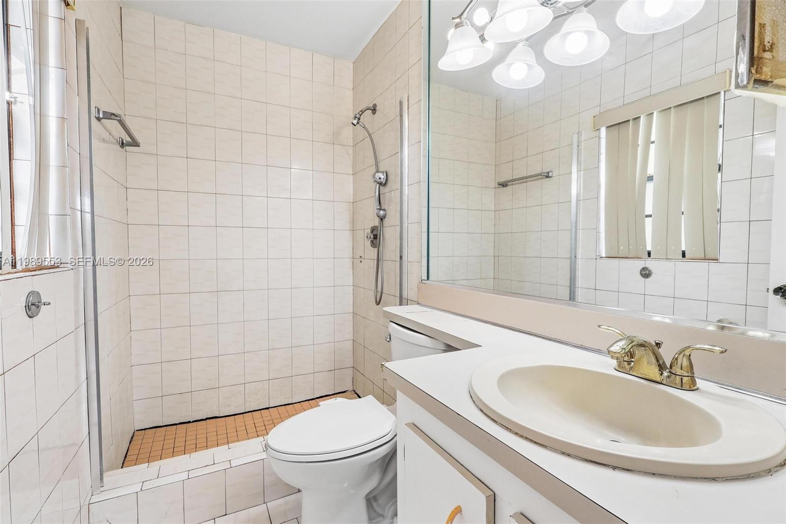 4210 Southwest 134th Avenue Miami, FL 33175 - Photo 19 of 32 a bathroom with a sink a toilet and shower