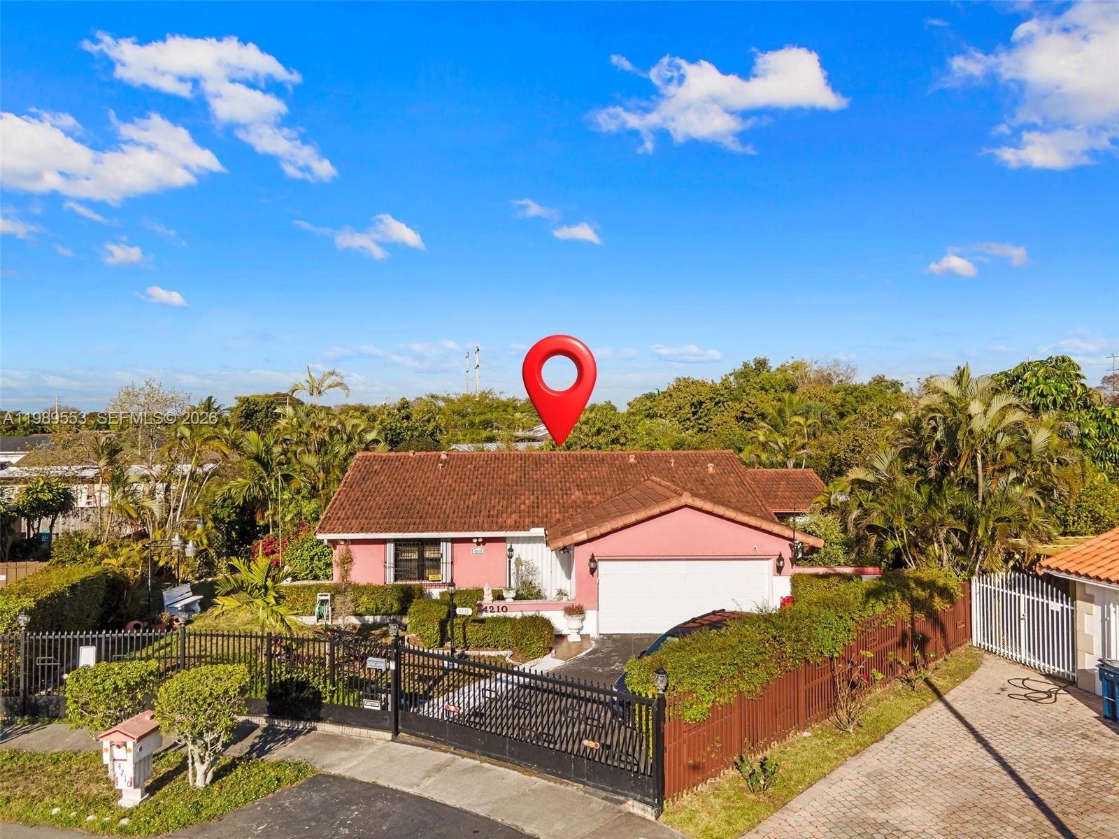 4210 Southwest 134th Avenue Miami, FL 33175 - Photo 2 of 32 a view of a house with a backyard