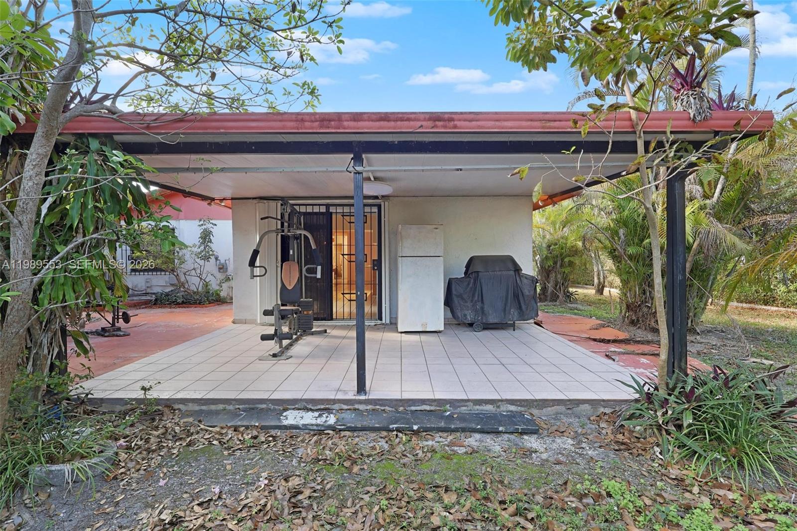 4210 Southwest 134th Avenue Miami, FL 33175 - Photo 22 of 32 a front view of a house with garden