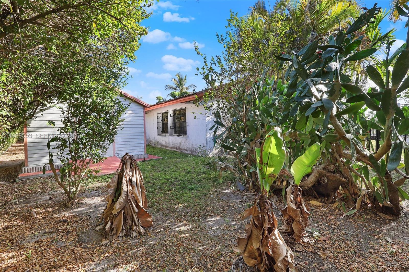 4210 Southwest 134th Avenue Miami, FL 33175 - Photo 24 of 32 a backyard of a house with lots of green space