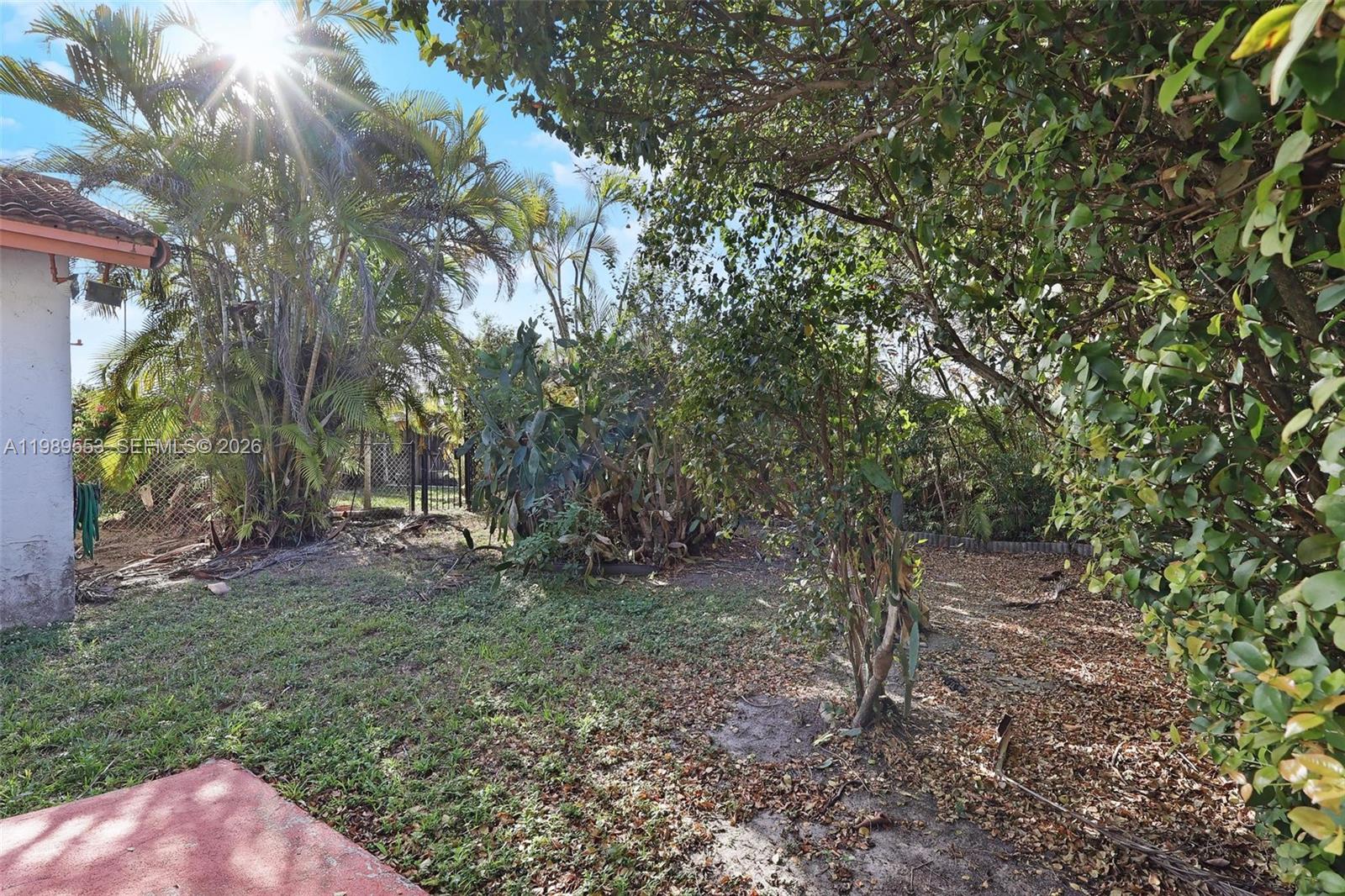 4210 Southwest 134th Avenue Miami, FL 33175 - Photo 26 of 32 a backyard of a house with lots of green space