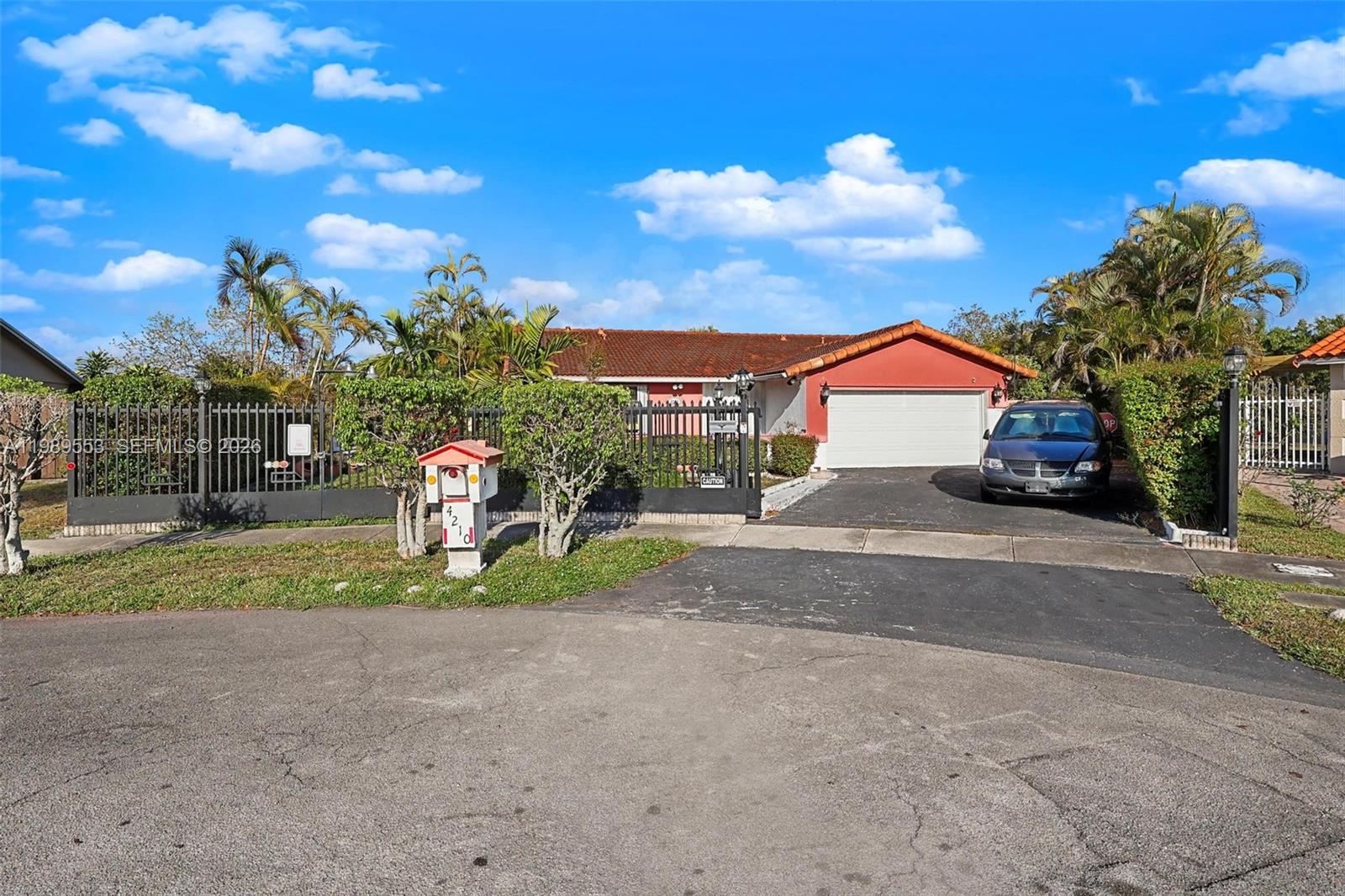 4210 Southwest 134th Avenue Miami, FL 33175 - Photo 5 of 32 a view of street with parked cars