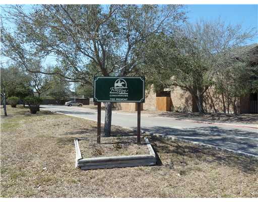 a front view of a house with trees