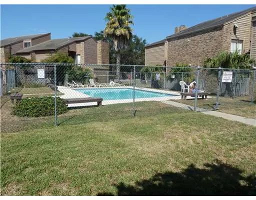 a view of a backyard with a patio