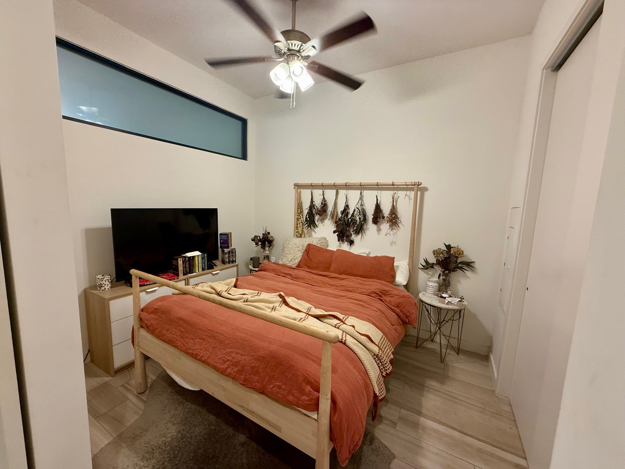 800 Embassy Drive, Unit 123 Austin, TX 78702 - Photo 37 of 39 a bedroom with a bed and a ceiling fan