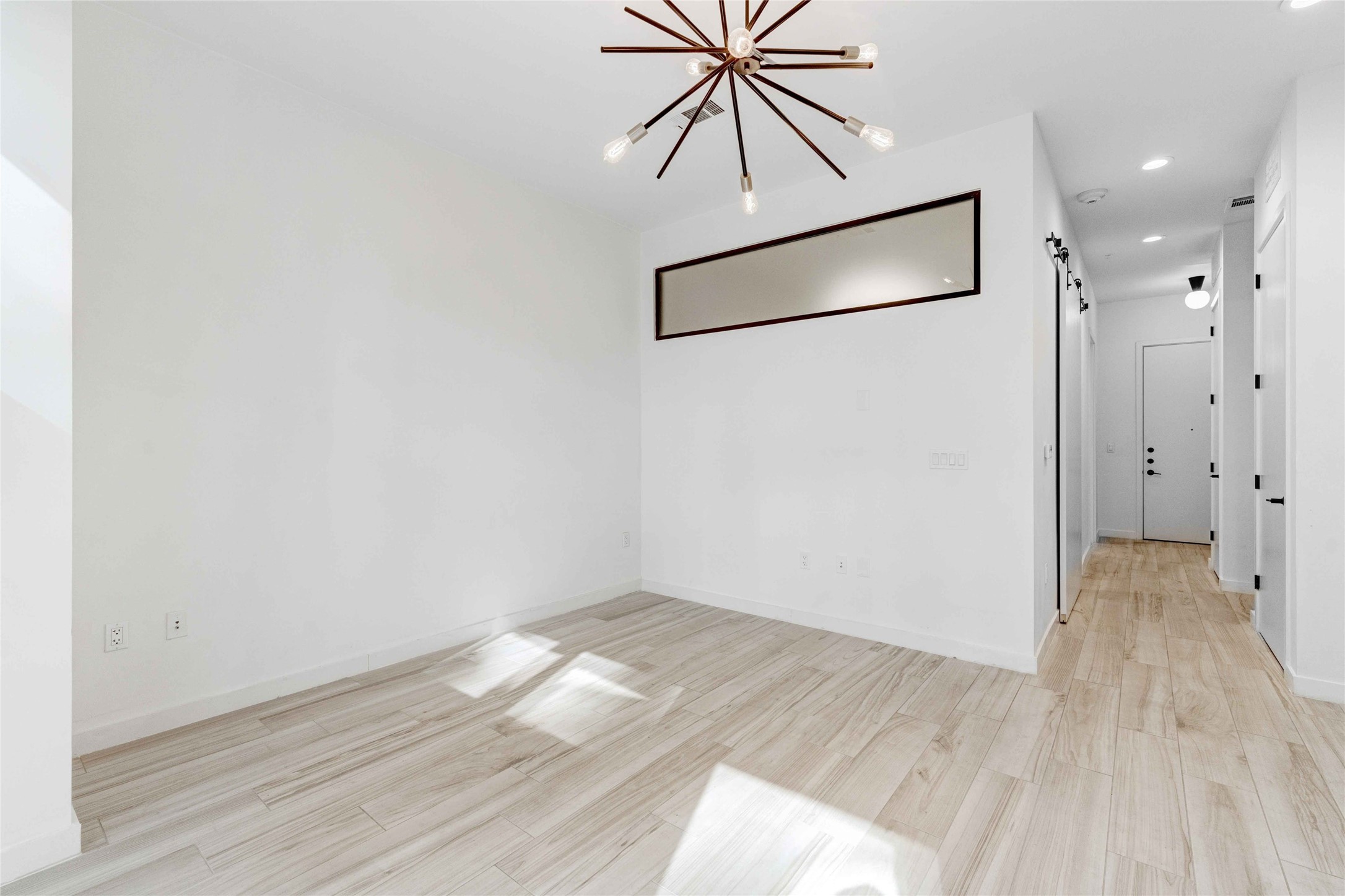 800 Embassy Drive, Unit 123 Austin, TX 78702 - Photo 7 of 39 wooden floor in an empty room