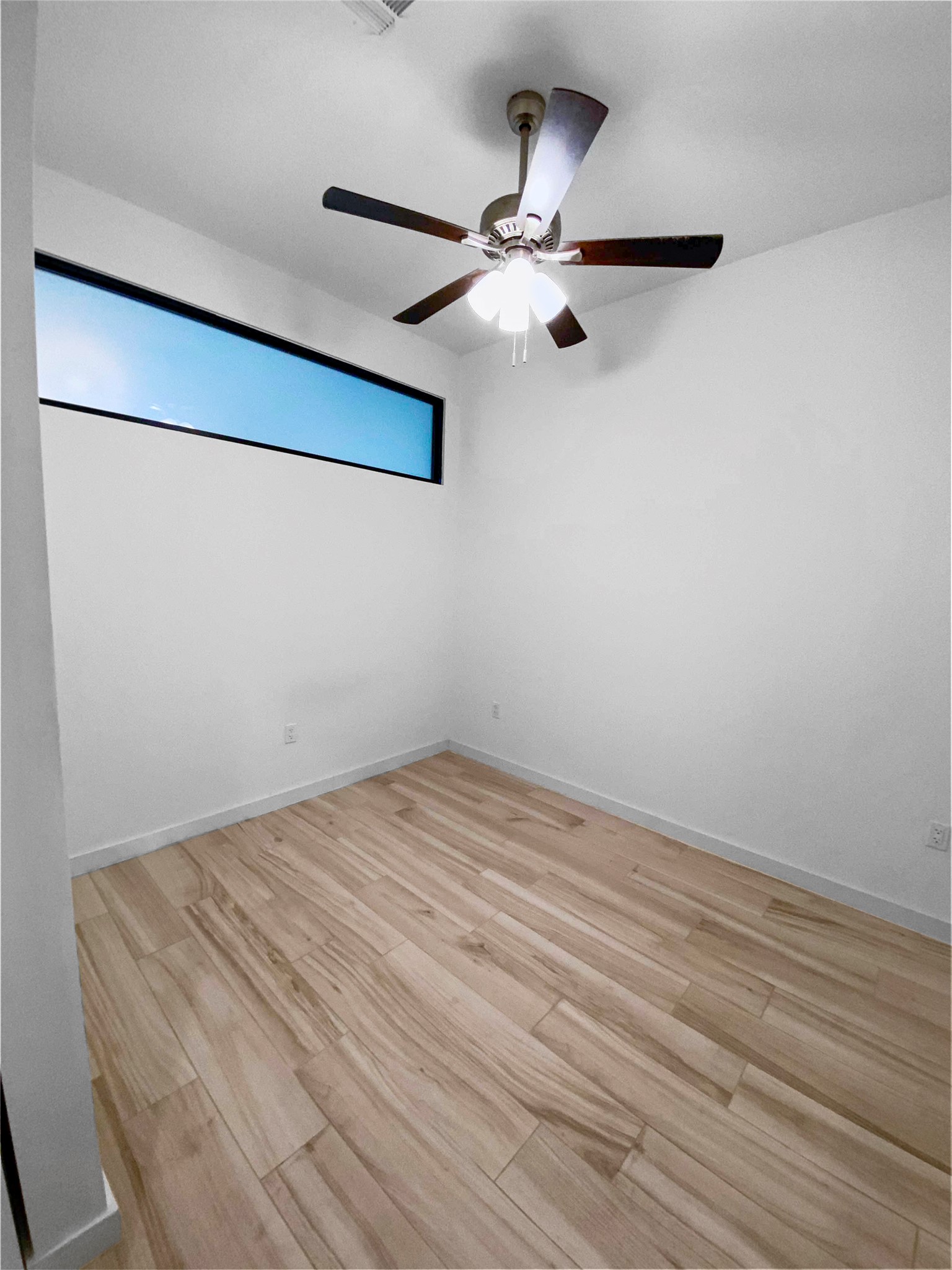 800 Embassy Drive, Unit 123 Austin, TX 78702 - Photo 10 of 39 a view of a room with wooden floor
