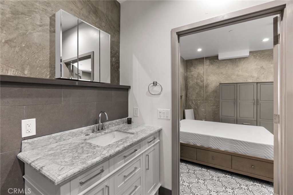 2211-1.2 Hyperion Avenue, Unit 1/2 Los Angeles, CA 90027 - Photo 12 of 15 a bathroom with a sink and a mirror
