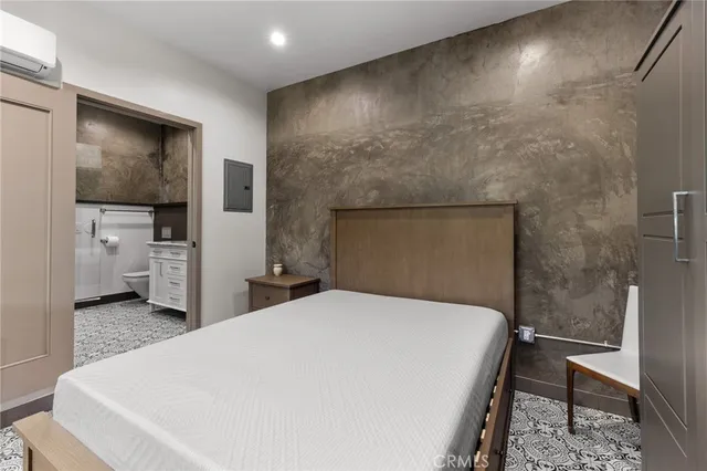 a large white bed in a white room