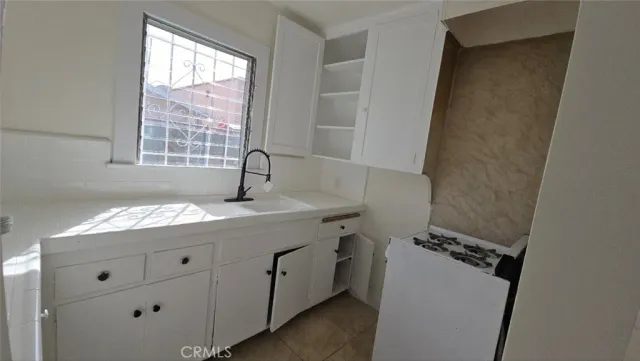 a white refrigerator freezer sitting inside of a kitchen