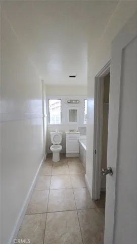 a bathroom with a sink a toilet and a bathtub