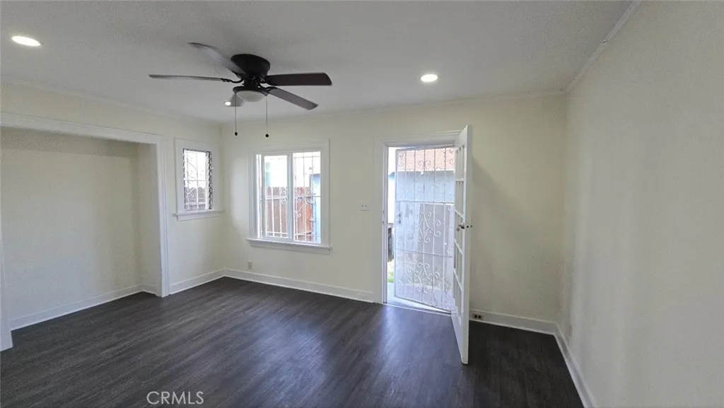 456 West 59th Place Los Angeles, CA 90003 - Photo 20 of 21 a view of an empty room with wooden floor and a window