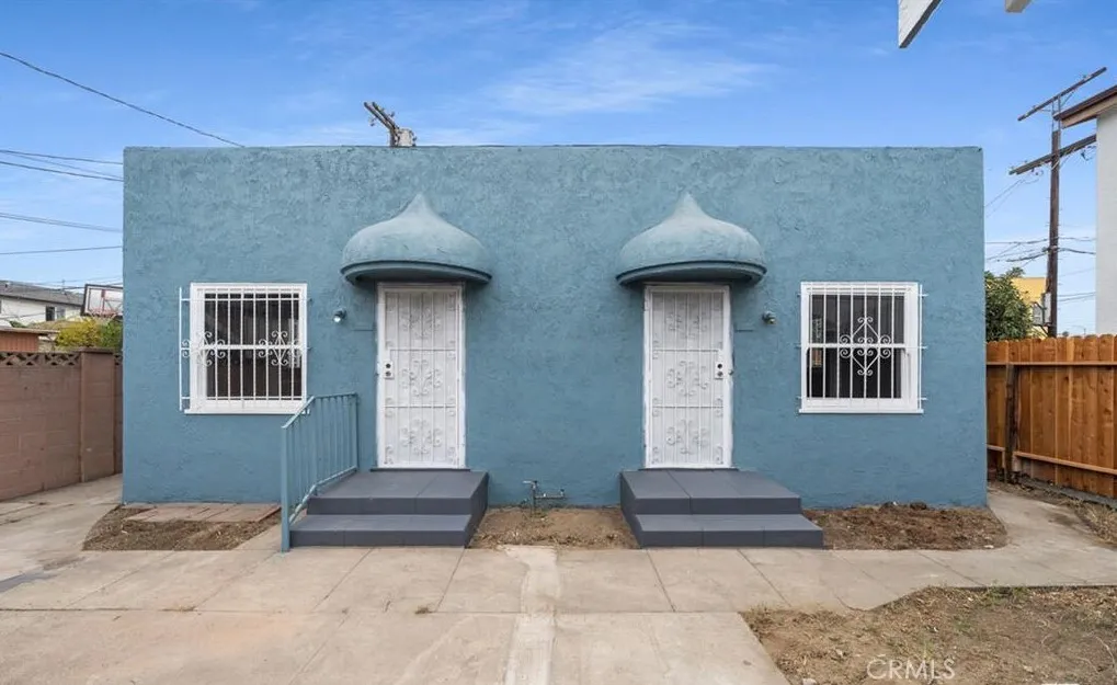 456 West 59th Place Los Angeles, CA 90003 - Photo 2 of 21 a front view of a house