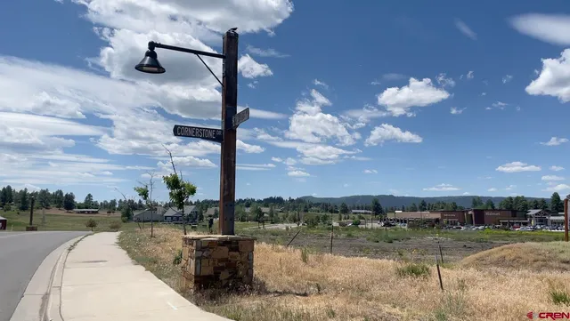 a balcony with table and chairs