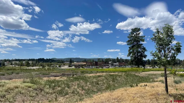 an aerial view of lake residential houses with outdoor space and seating