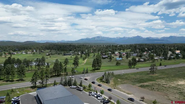 an aerial view of lake residential houses with outdoor space and seating