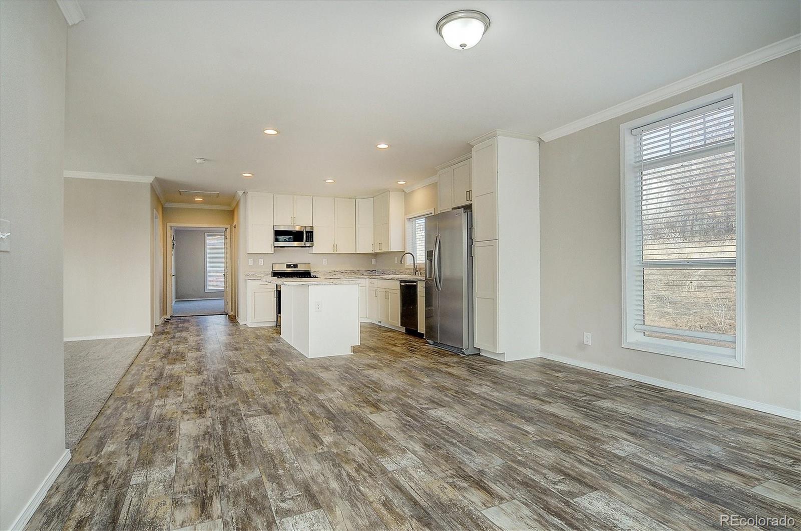 16554 Rocky Mountain Road Salida, CO 81201 - Photo 12 of 33 a view of kitchen with stainless steel appliances granite countertop a refrigerator sink and cabinets