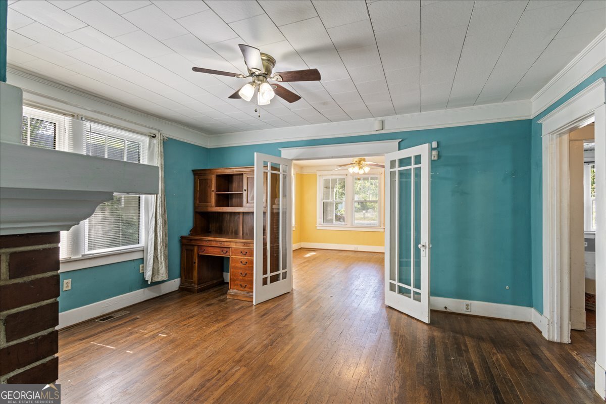 1823 Starnes Street Augusta, GA 30904 - Photo 15 of 34 a view of a livingroom with furniture wooden floor ceiling fan and windows