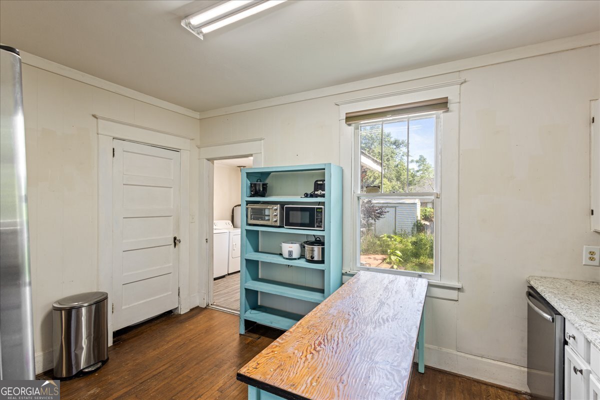 1823 Starnes Street Augusta, GA 30904 - Photo 19 of 34 a view of a bedroom with wooden floor and a cabinet