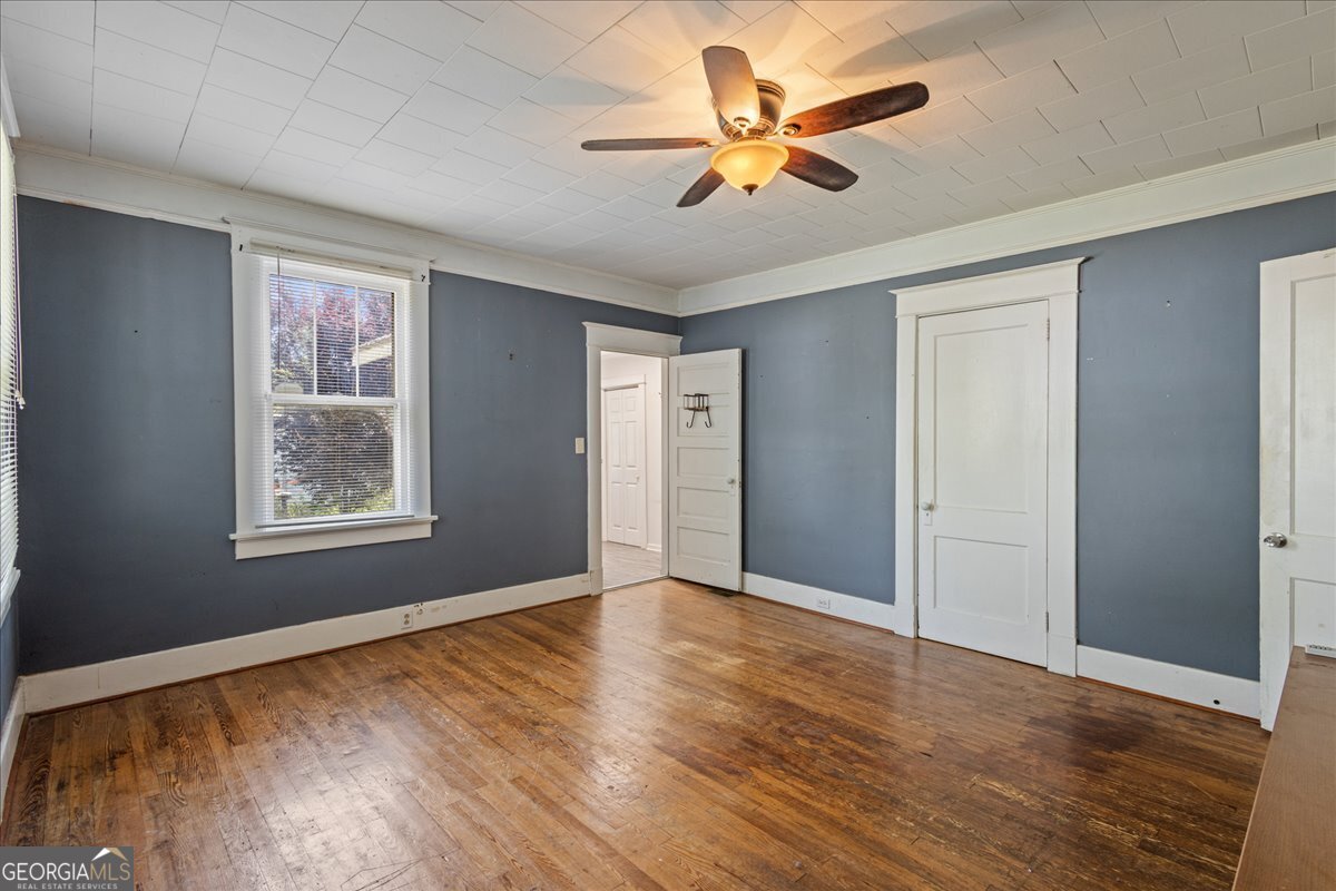 1823 Starnes Street Augusta, GA 30904 - Photo 23 of 34 a view of an empty room with window and wooden floor
