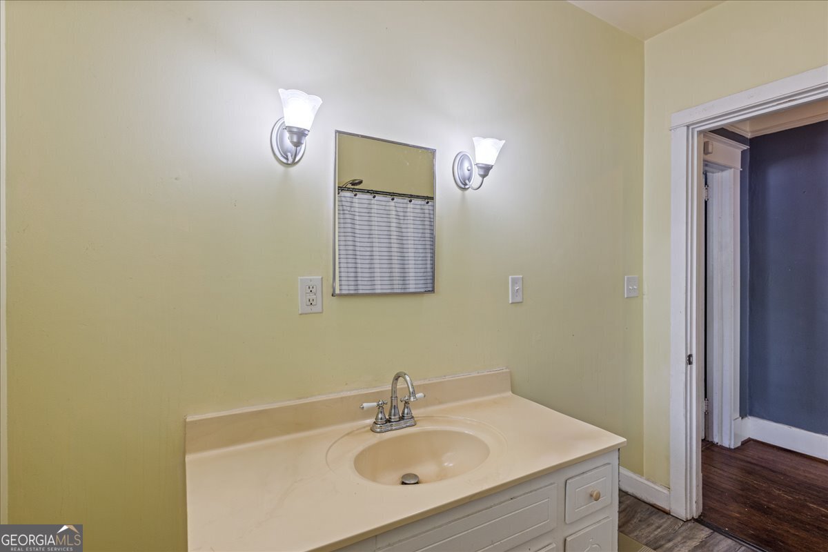 1823 Starnes Street Augusta, GA 30904 - Photo 26 of 34 a bathroom with a sink mirror and vanity