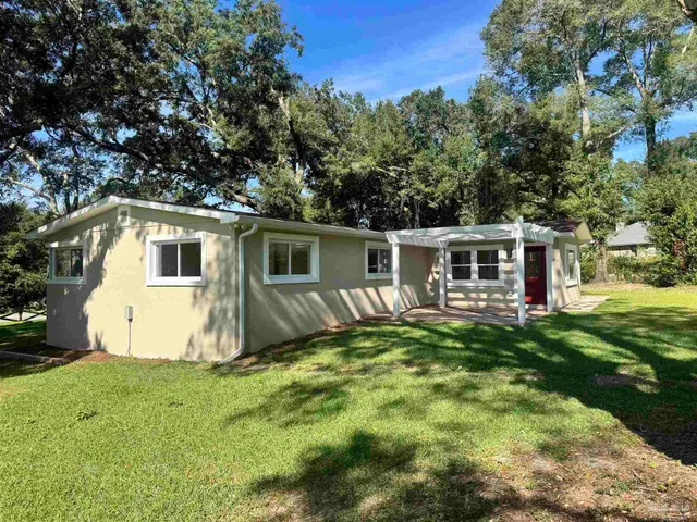 a view of a back yard of the house