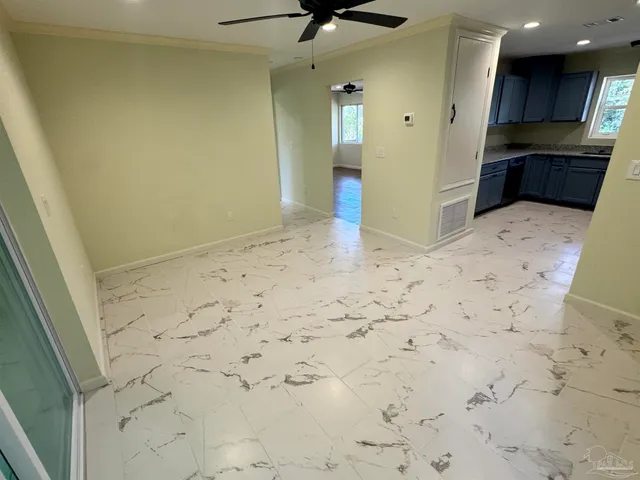 a view of kitchen with cabinets and wooden floor