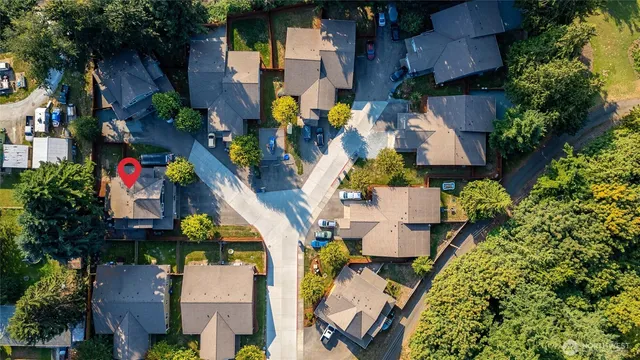 an aerial view of residential houses with outdoor space