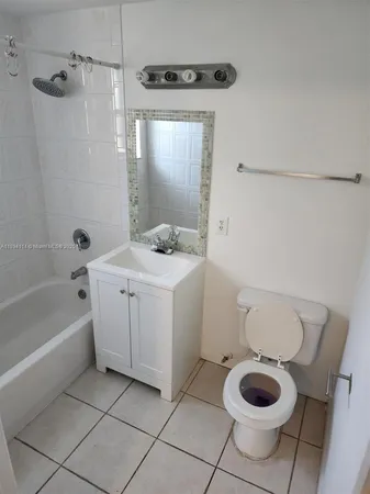 a bathroom with a sink toilet and a bathtub