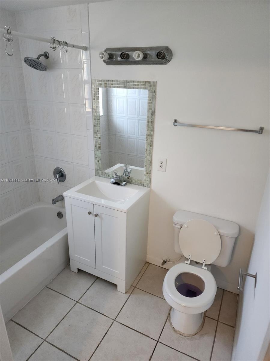14240 Northwest 22nd Avenue, Unit 3 Opa-Locka, FL 33054 - Photo 11 of 49 a bathroom with a sink toilet and a bathtub