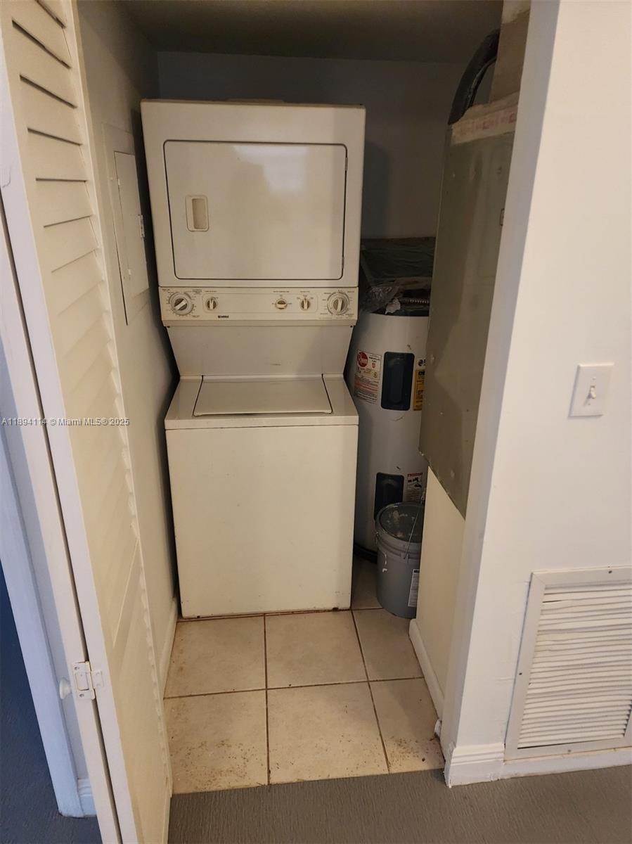 14240 Northwest 22nd Avenue, Unit 3 Opa-Locka, FL 33054 - Photo 12 of 49 a utility room with dryer and washer