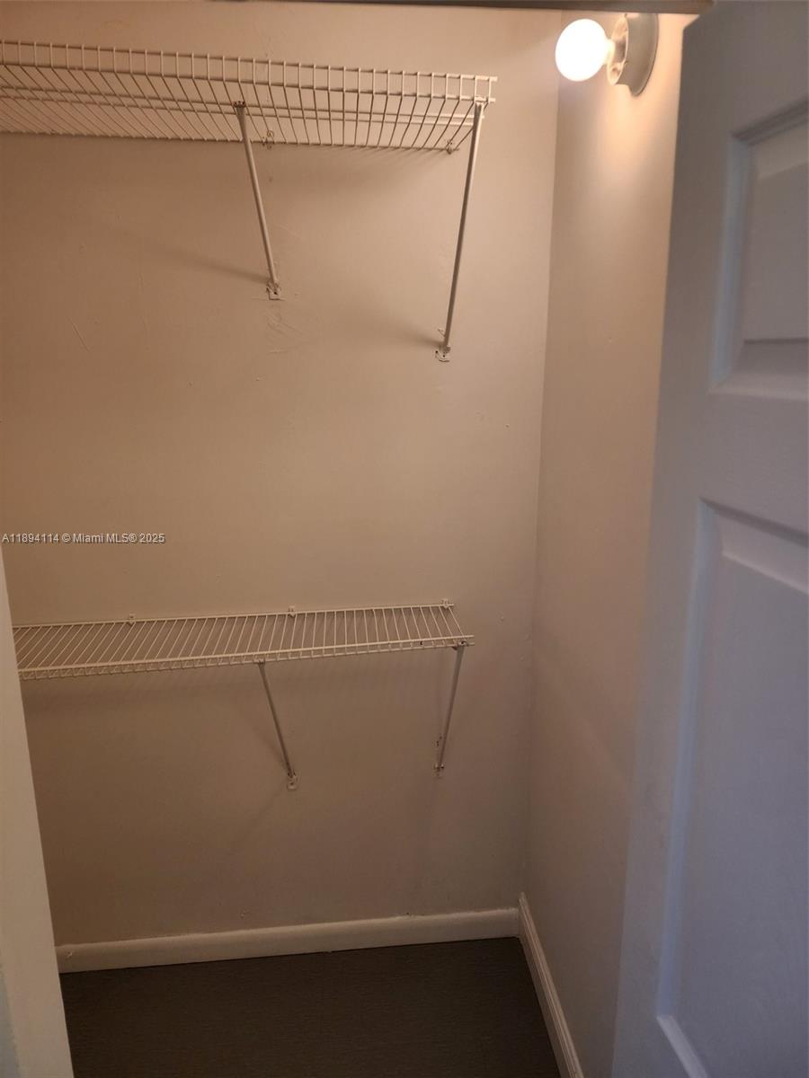 14240 Northwest 22nd Avenue, Unit 3 Opa-Locka, FL 33054 - Photo 18 of 49 a view of small space with racks on the wall