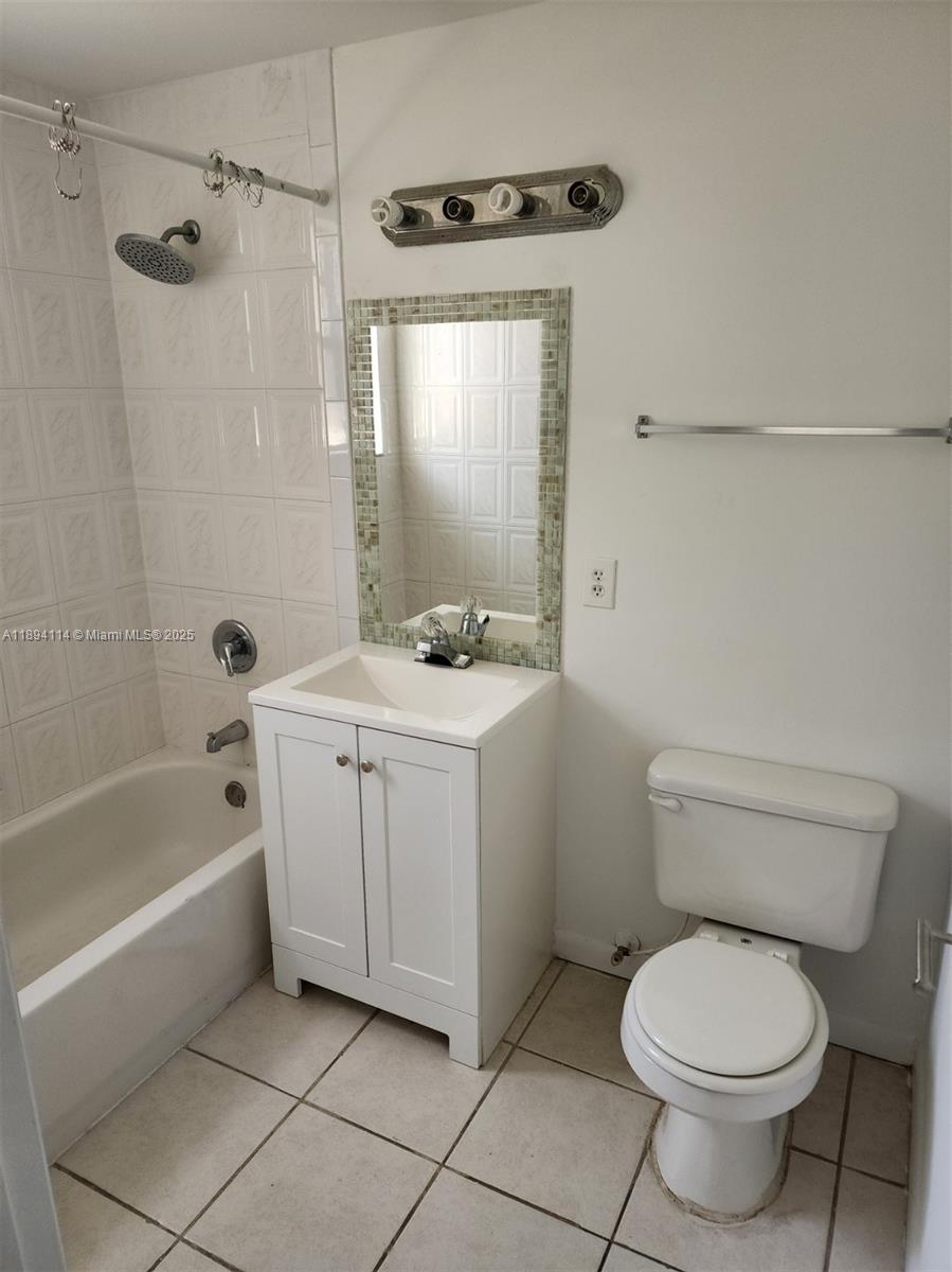 14240 Northwest 22nd Avenue, Unit 3 Opa-Locka, FL 33054 - Photo 34 of 49 a bathroom with a sink a toilet and shower